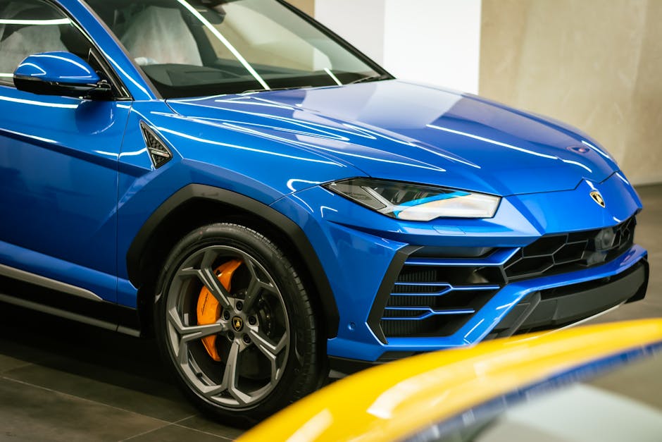 Stunning blue Lamborghini SUV showcased indoors, highlighting luxury automotive design.